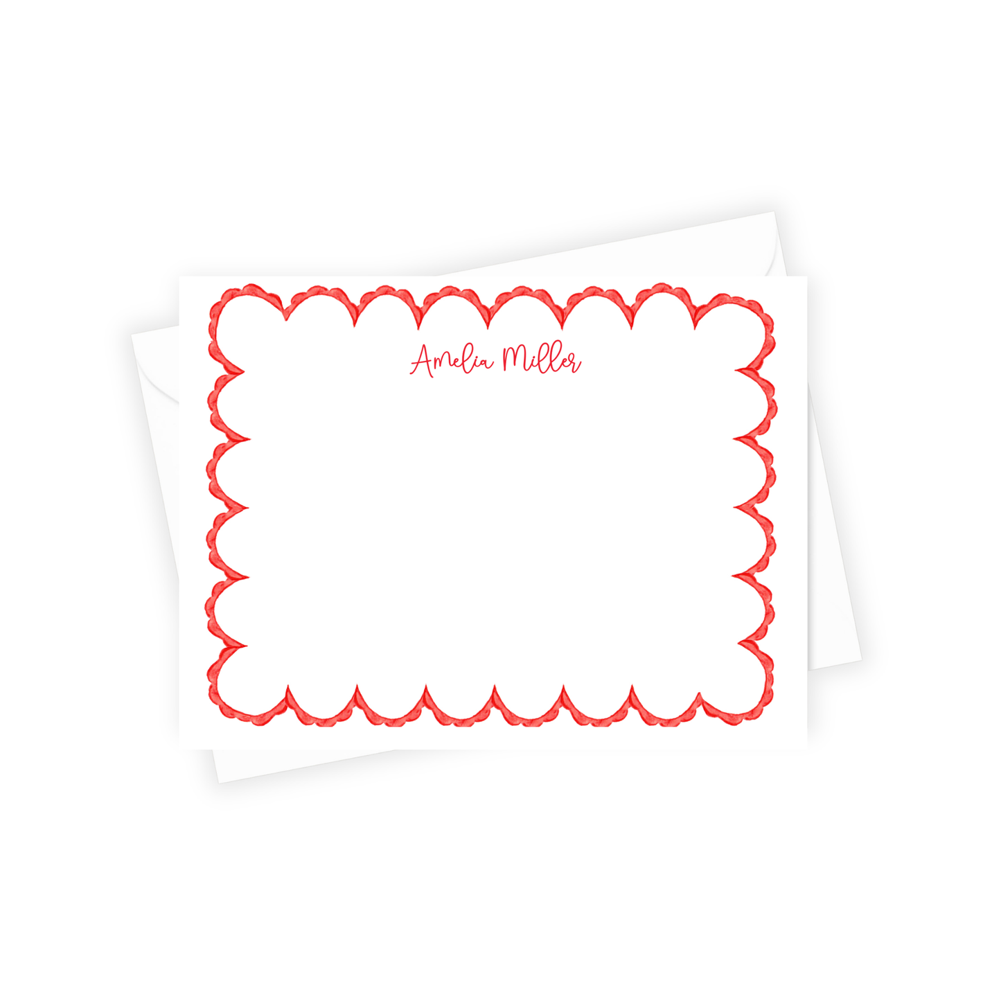 White pillow with red scalloped border and 'Amelia Miller' text on a white background
