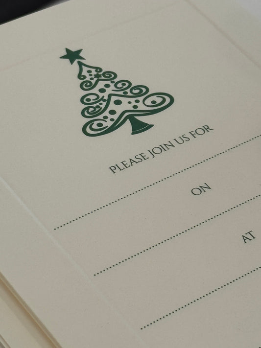 Close-up of a card with a decorative tree and text on a white background