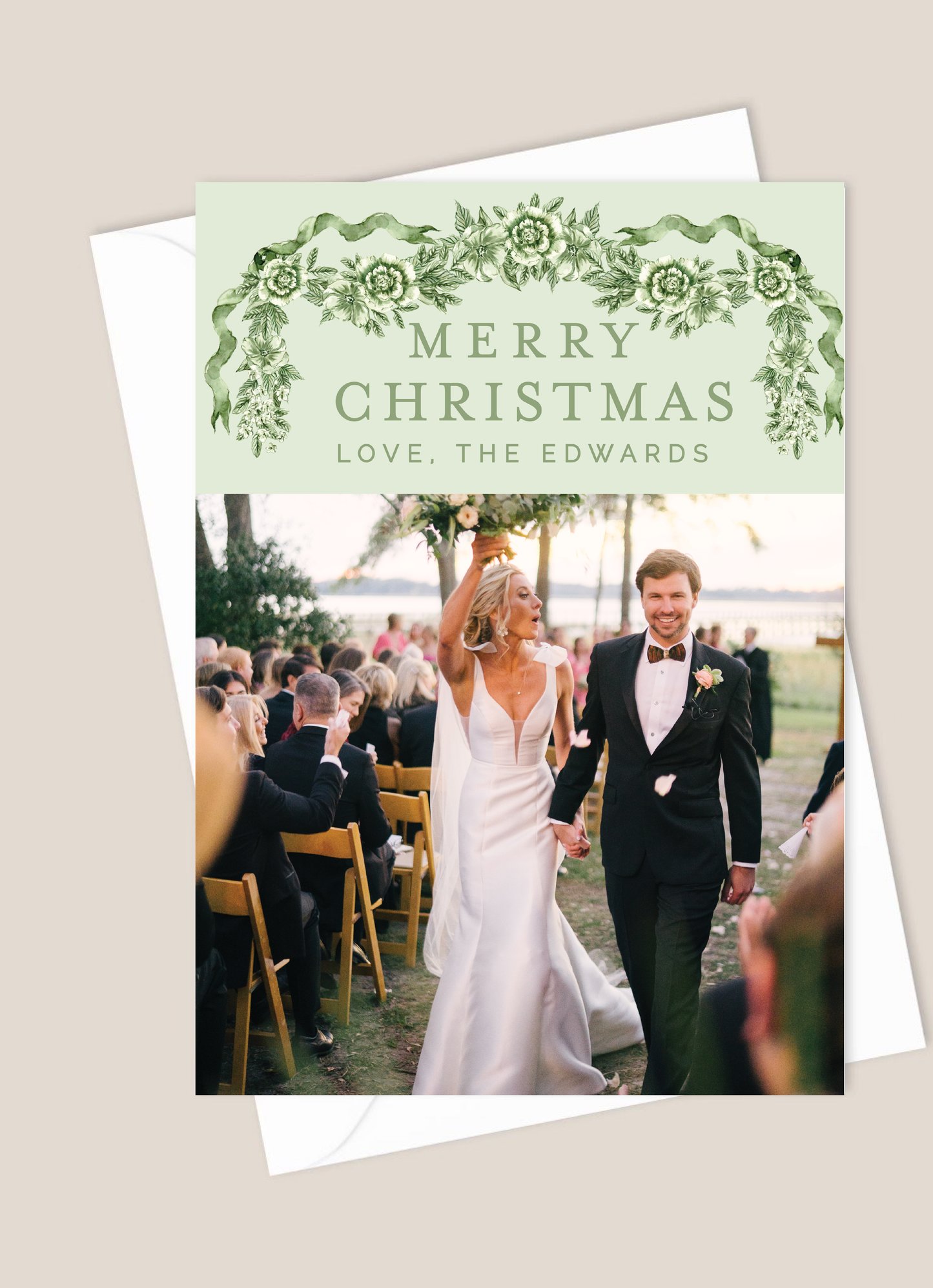 Christmas card with a wedding photo and 'Merry Christmas' text on a light green background