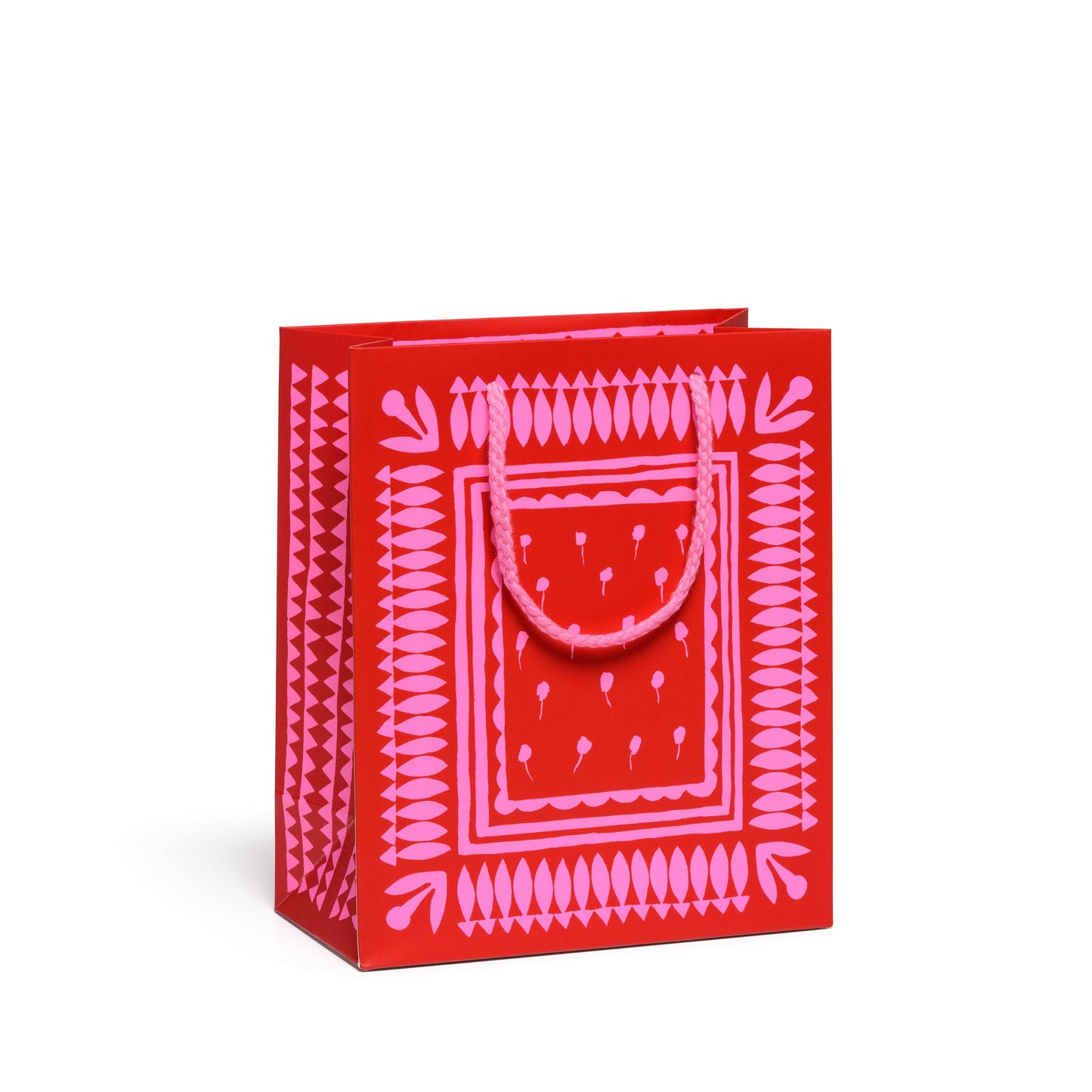Red gift bag with pink geometric pattern on a white background
