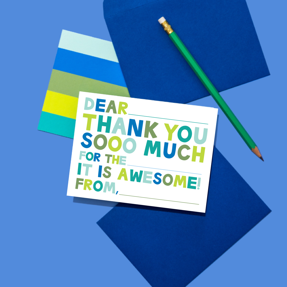 Colorful card with a message of gratitude on a blue background with a pencil.