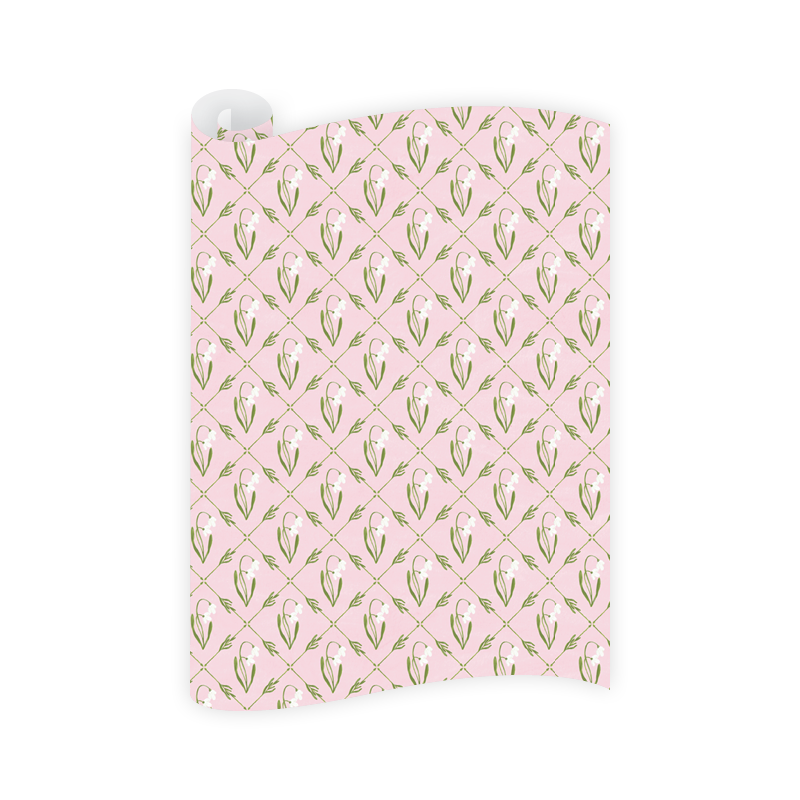 pink wrapping paper featuring a green geometric pattern on a white background