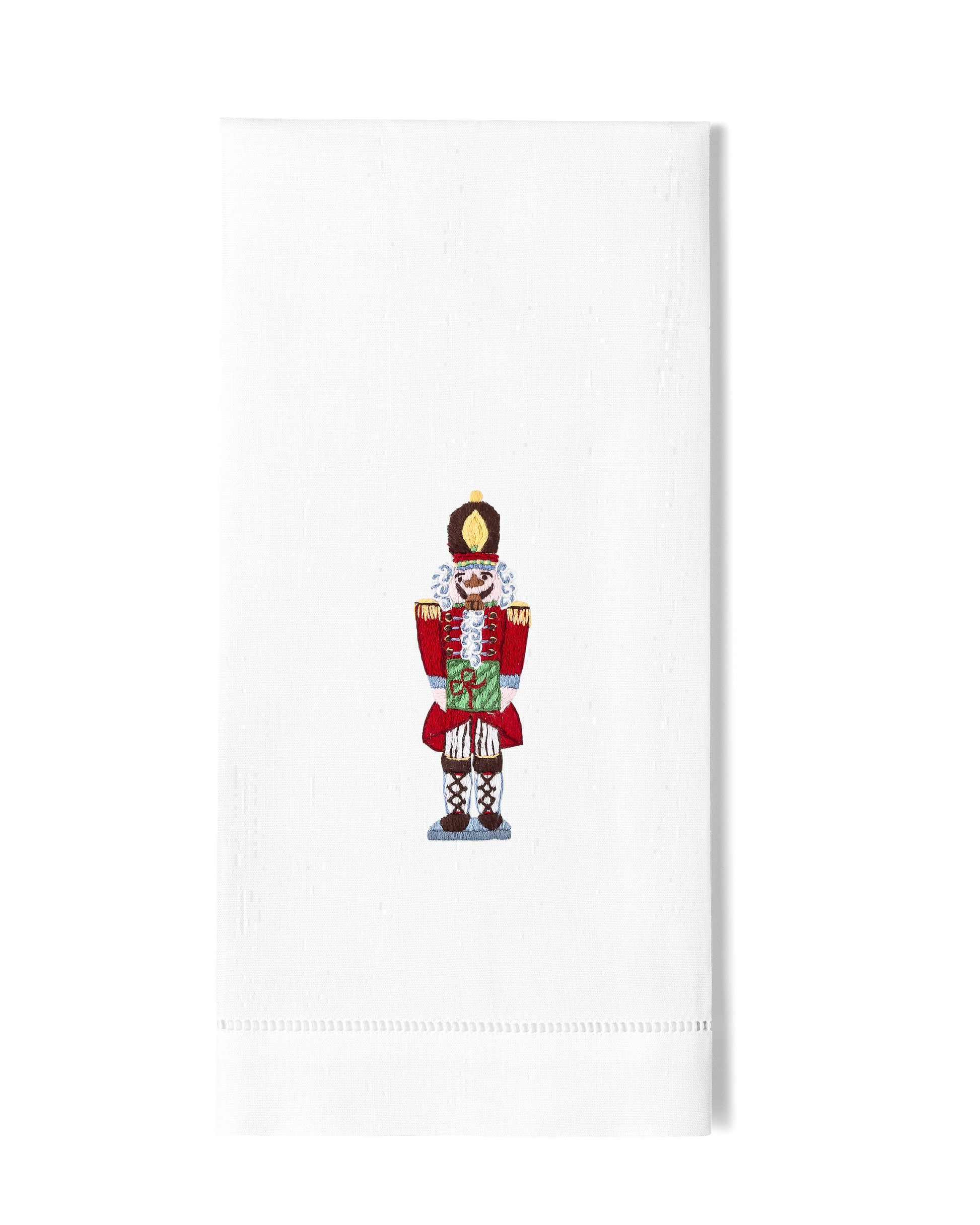 White towel with a decorative nutcracker 