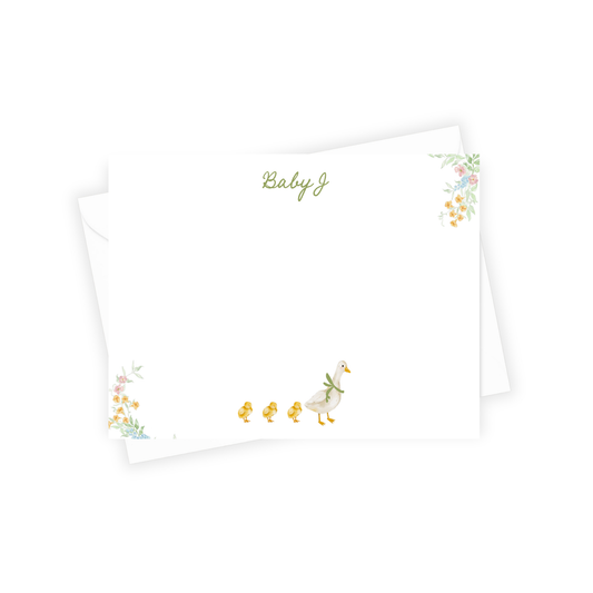 Stationery with duck design and 'Baby J' text on a white background