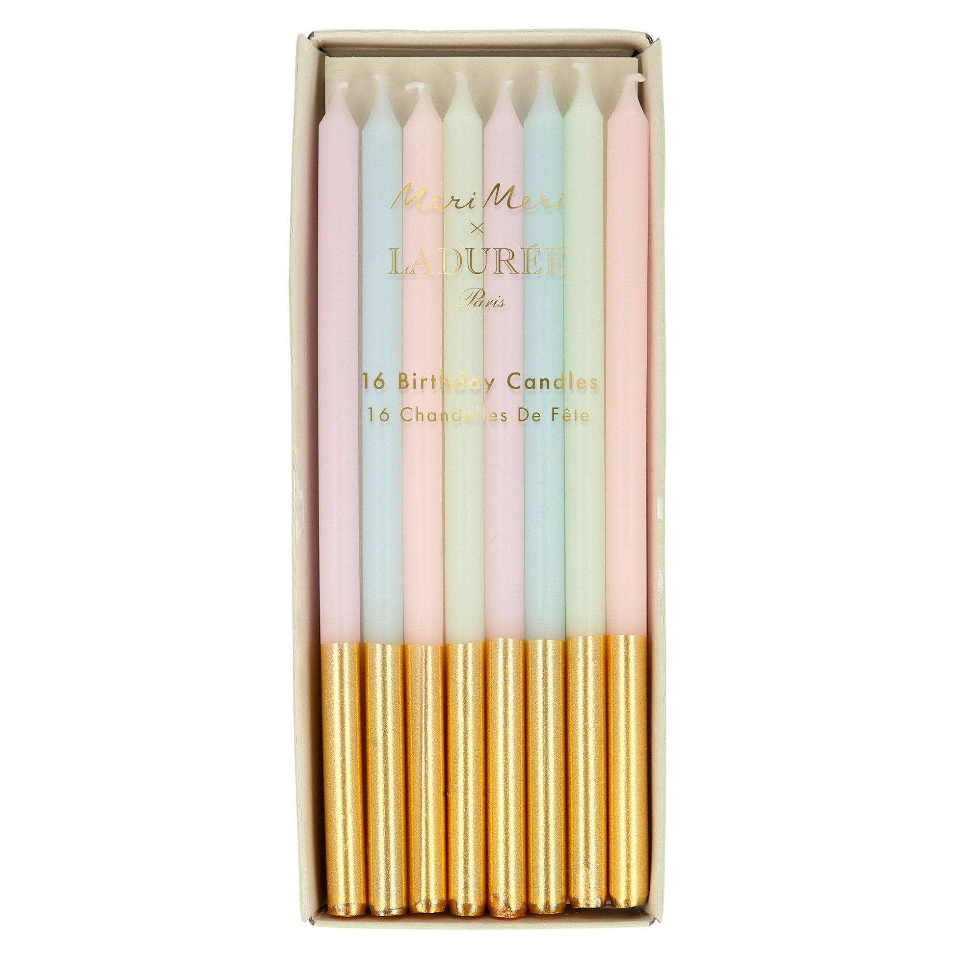 Set of pastel-colored birthday candles with gold tips in a box, featuring the brand 'La Ruer'.