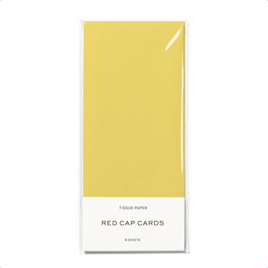 Yellow tissue paper pack with 'Red Cap Cards' branding on a white background