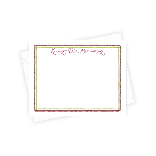 Personalized notepad with decorative border and name 'Kathryn Elle Montgomery' on a white background