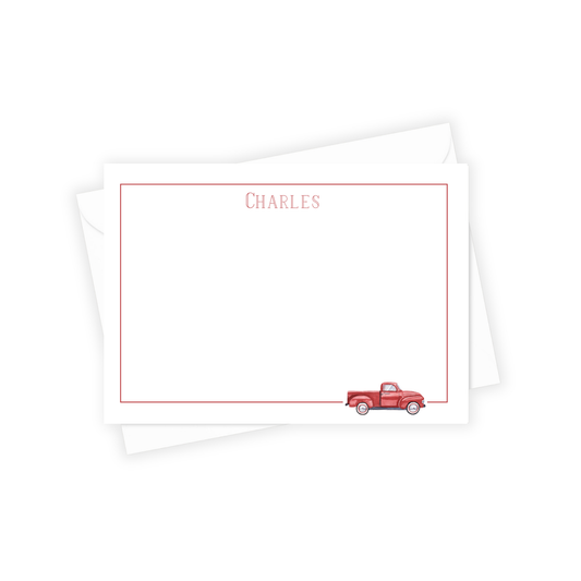 Note card with red truck illustration and 'CHARLES' text on a white background