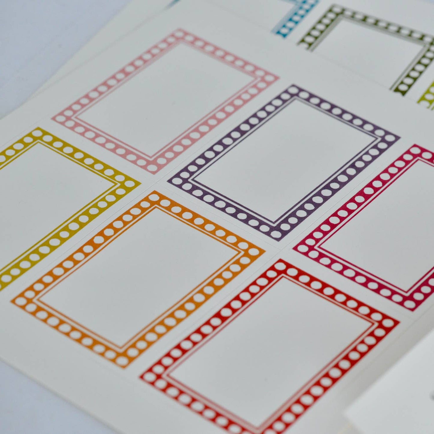 Colorful square border stickers on a white background