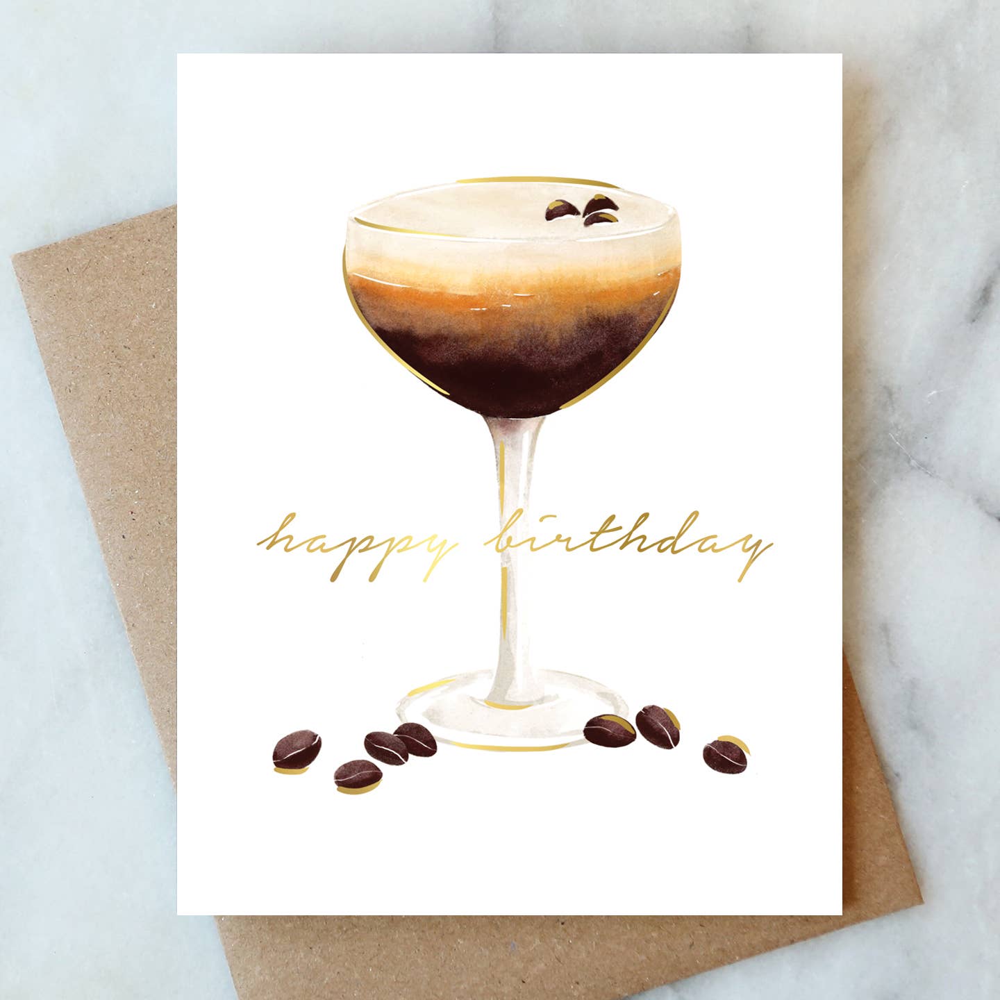 Greeting card with a cocktail and 'happy birthday' text on a marble surface