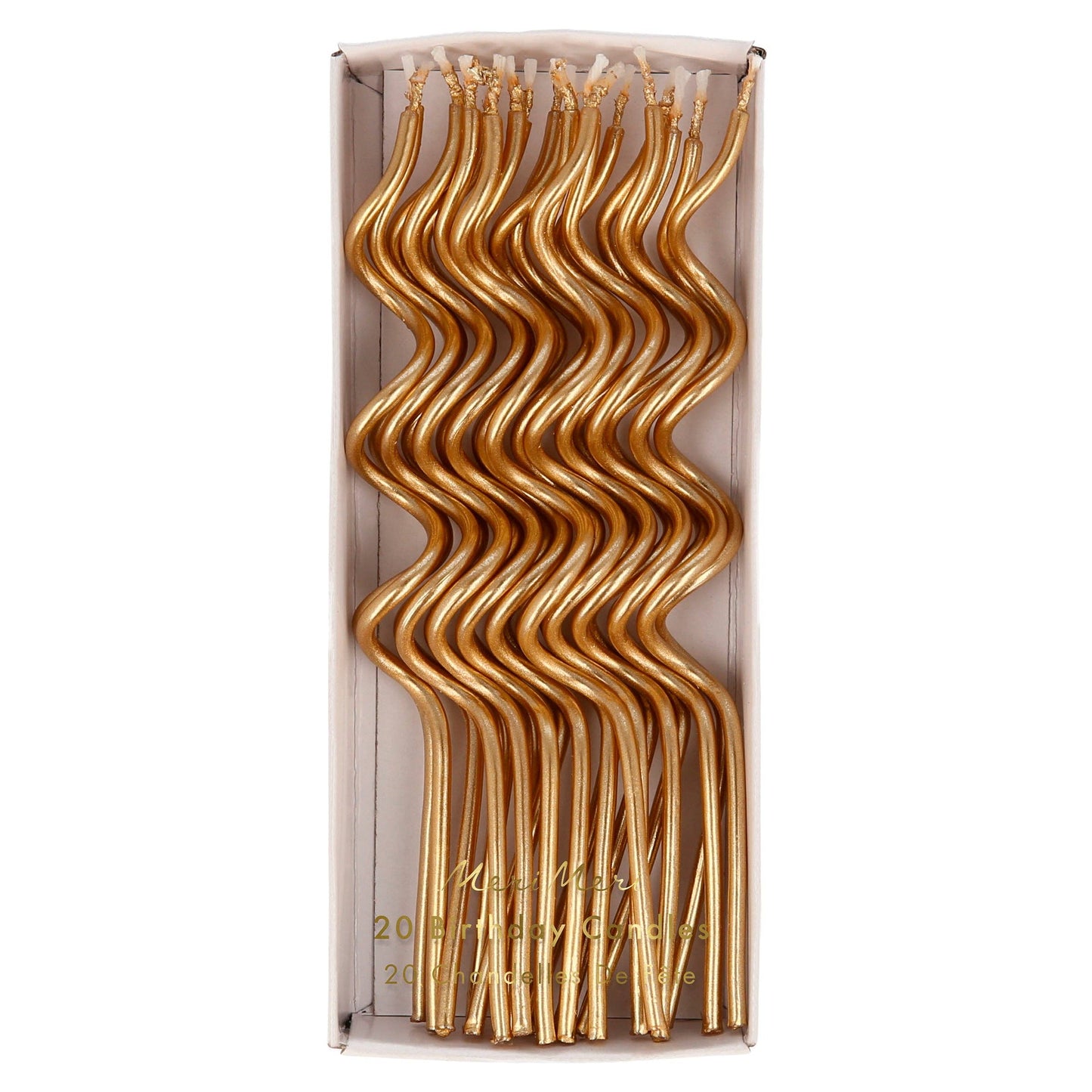Box of gold candles with wavy design on a white background