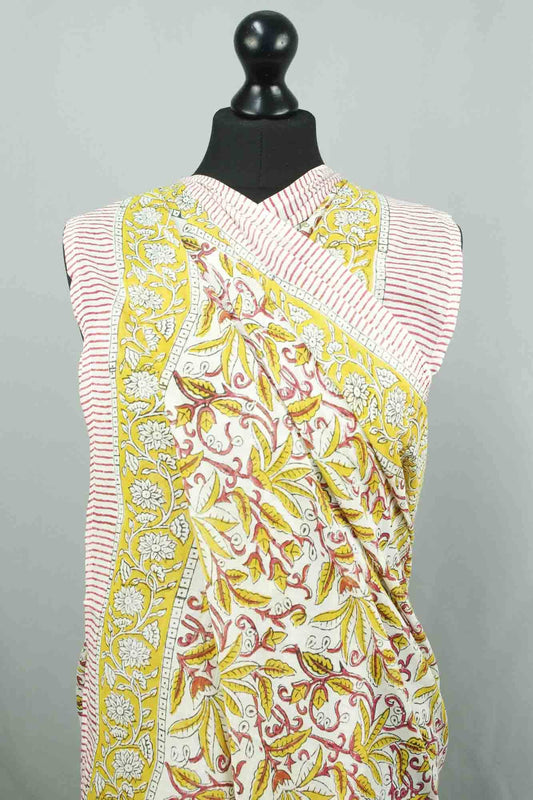 Saree with floral pattern on a mannequin against a gray background