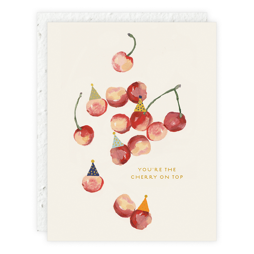 Card with cherries wearing party hats and text 'You're the cherry on top' on a beige background