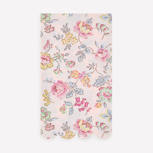Floral patterned fabric swatch on a light pink background