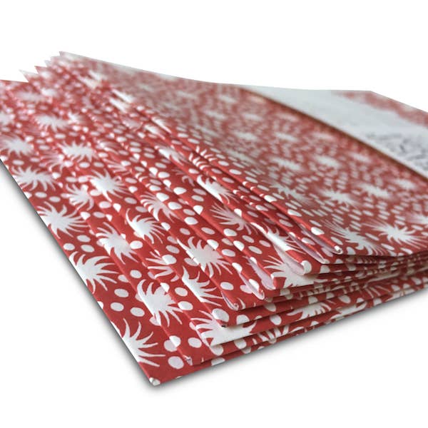 Red and white patterned paper with a white background