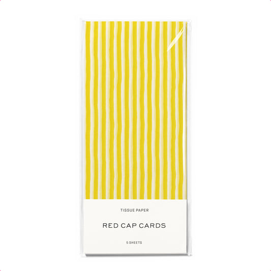 Yellow striped tissue paper packaging with 'Red Cap Cards' branding on a white background