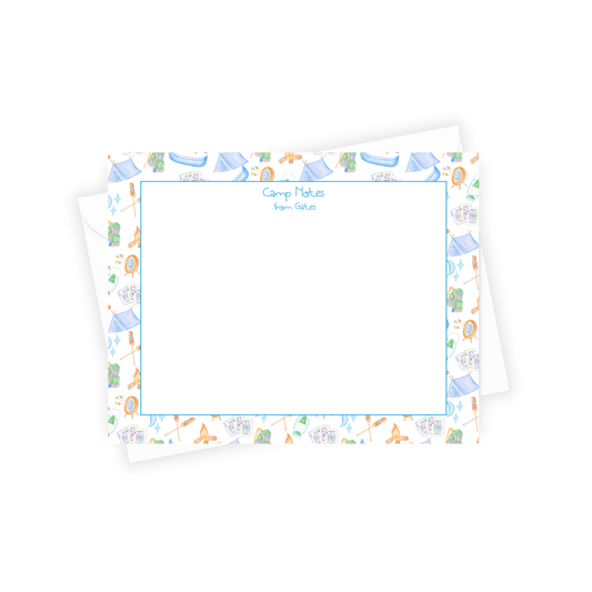 Note card with colorful border featuring camping-themed illustrations on a white background