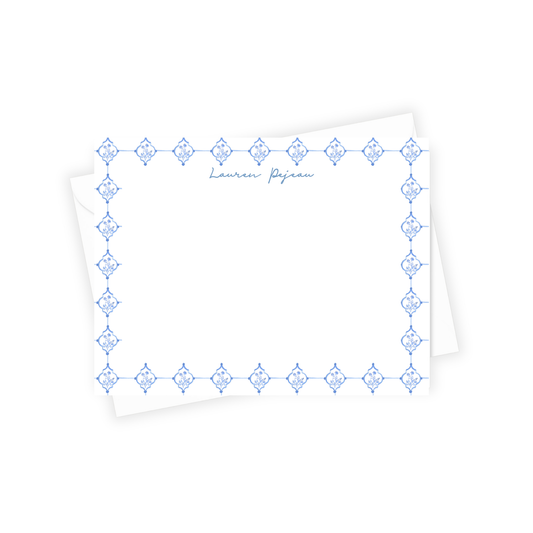 White paper with blue decorative border and 'Lauren Pejman' text on a white background
