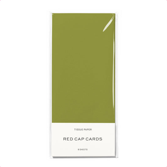 Pack of tissue paper with 'Red Cap Cards' branding on a pink background