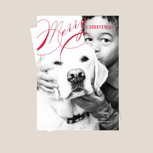 Christmas card with a child holding a dog, featuring the text 'Merry Christmas'.