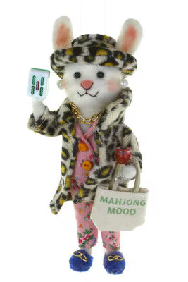 Stuffed animal rabbit in a leopard print coat holding a mahjong mood bag.