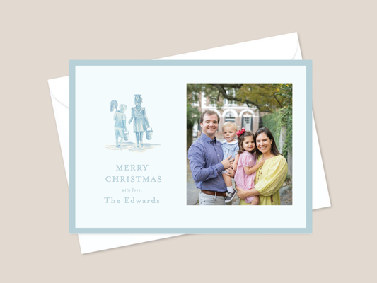 Blue holiday card with kids walking on beach