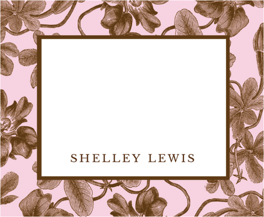 Floral design with a white center and 'SHELLEY LEWIS' text on a pink background