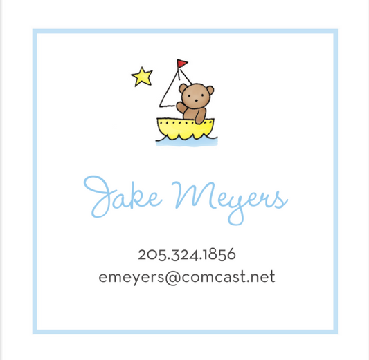 Business card with a cartoon bear on a sailboat, star, and contact information.
