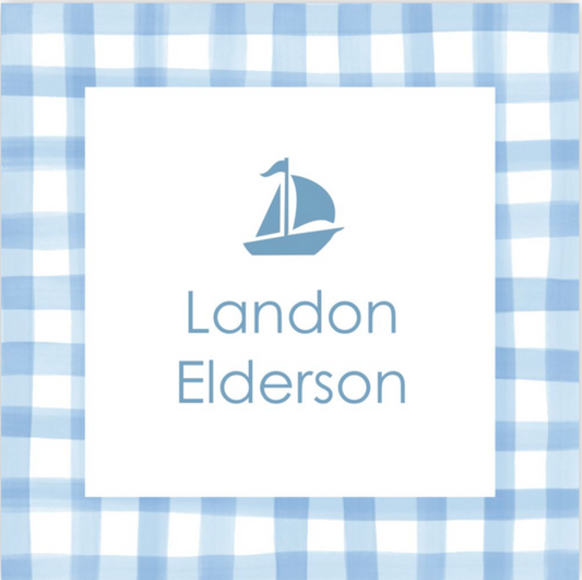 Nameplate with sailboat icon on a blue and white checkered background