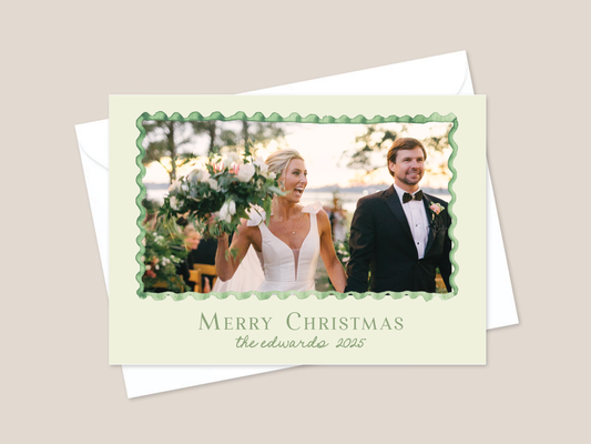 Christmas card with a couple on a wedding day, featuring 'Merry Christmas' text.