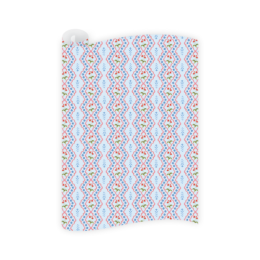 Patterned wrapping paper with blue, red, and green design on a white background