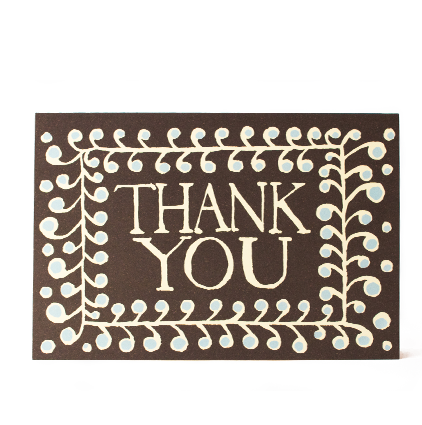 Brown card with 'Thank You' text and decorative border on a white background