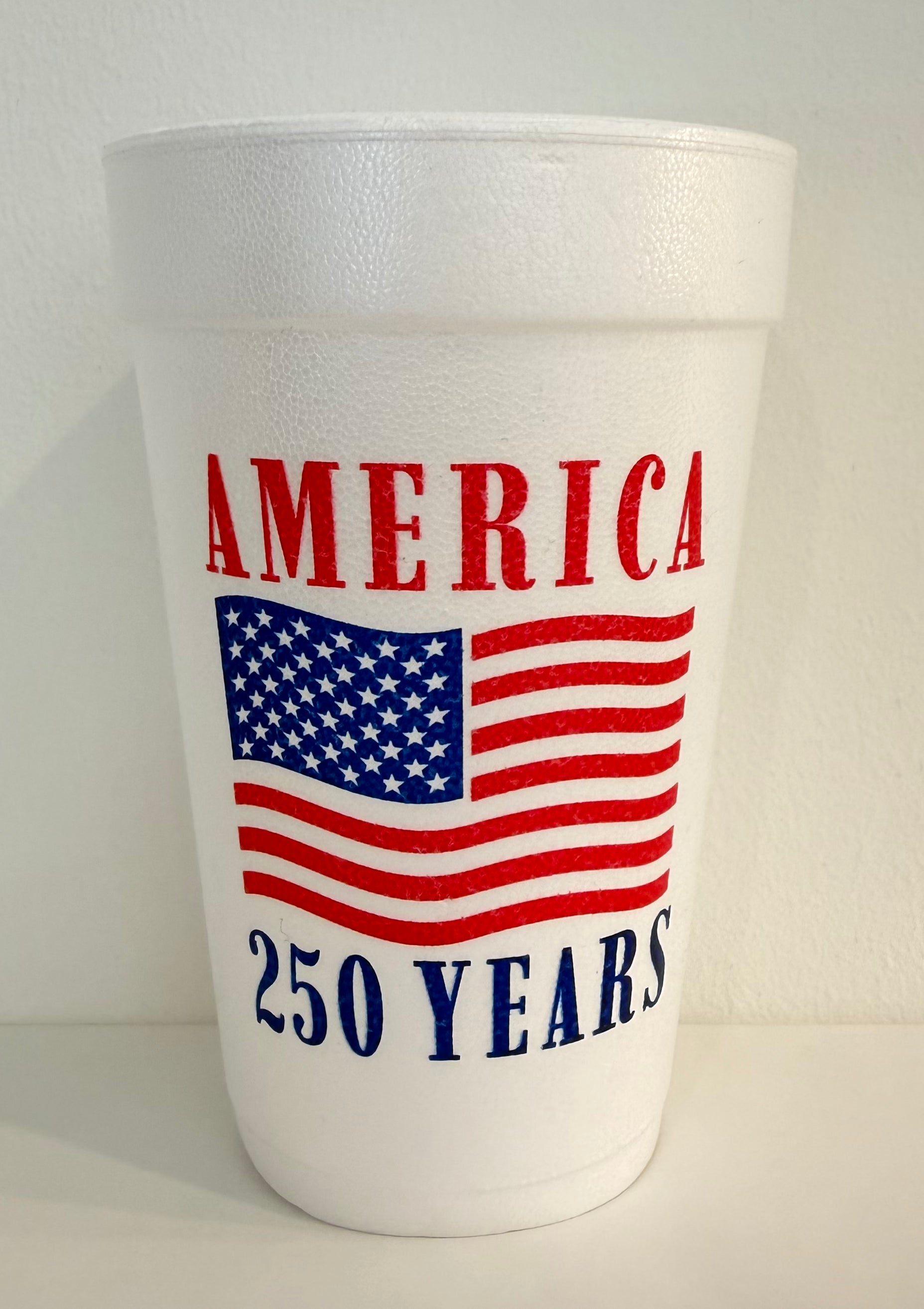 White foam cup with 'AMERICA 250 YEARS' text and American flag design on a white background