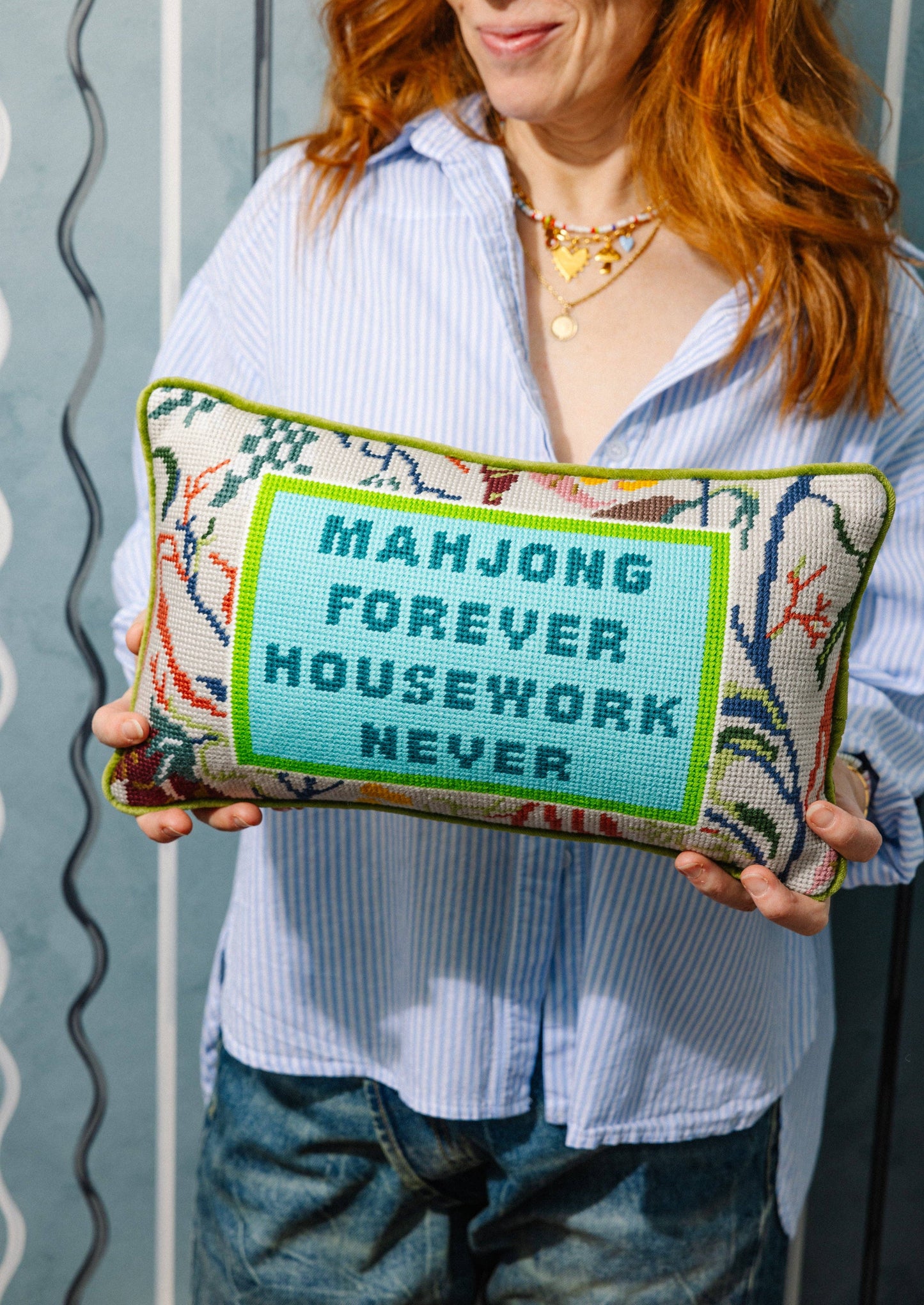 needlepoint pillow with 'MAHJONG FOREVER HOUSEWORK NEVER' text.