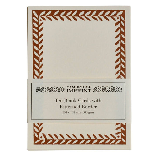 Pack of ten blank cards with patterned border packaging on a white background