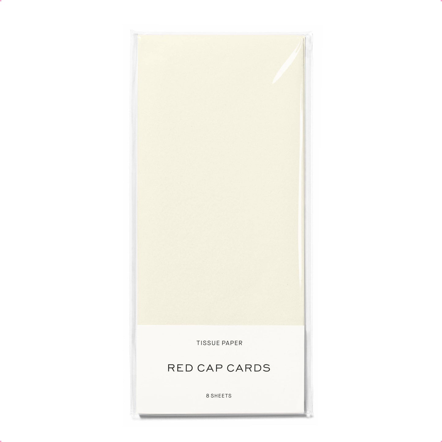 Pack of tissue paper with 'Red Cap Cards' branding on a white background