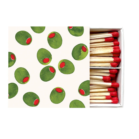 Matchbox with green and red pattern on the cover and matches inside.