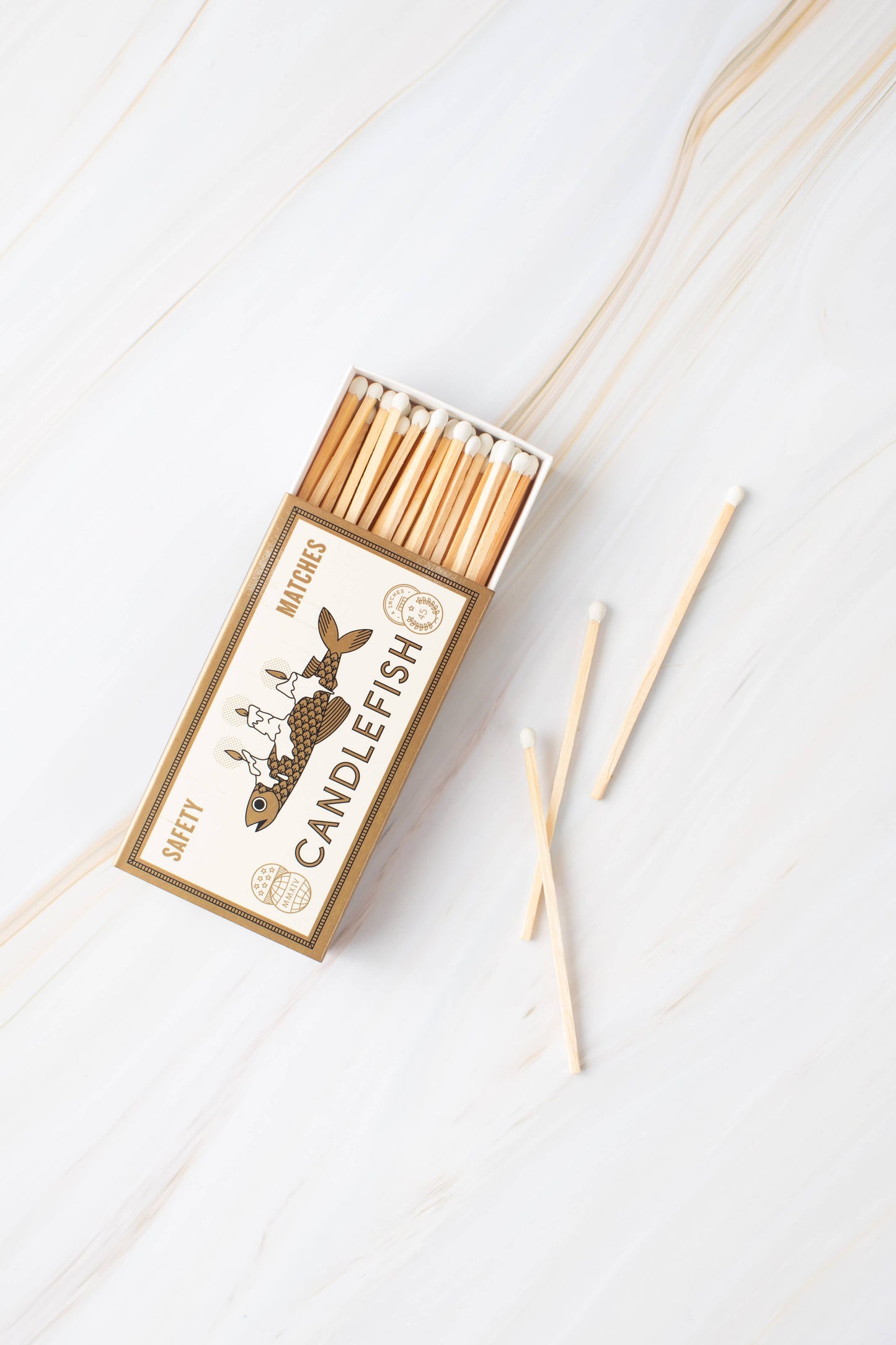 Box of matches with 'Candlefish' branding on a white background