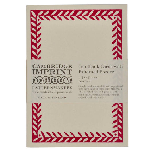 Pack of Cambridge Imprint blank cards with red patterned border on beige background