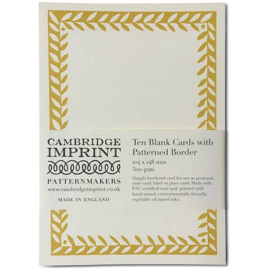 Pack of Cambridge Imprint blank cards with gold border on a white background