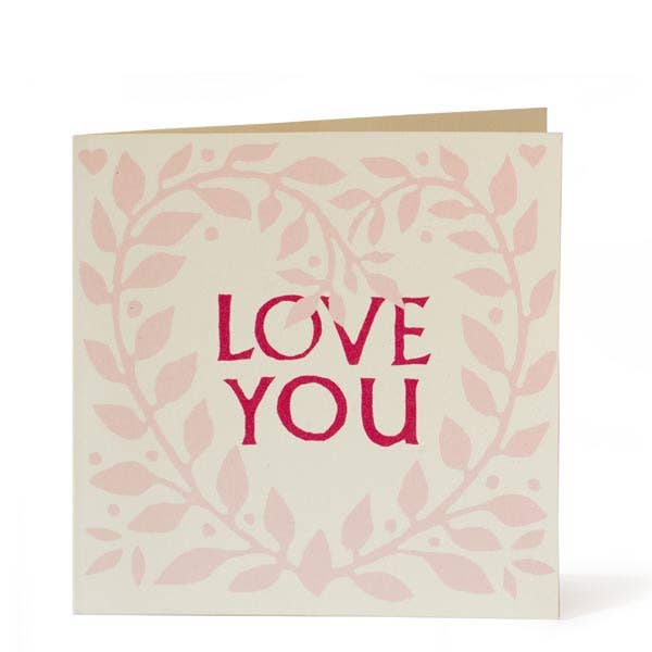 Greeting card with 'LOVE YOU' text on a leafy design