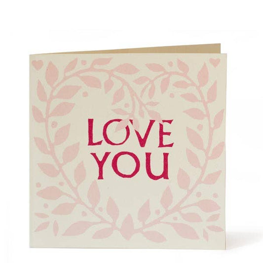 Greeting card with 'LOVE YOU' text on a leafy design