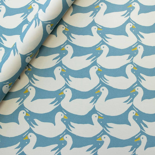 Pattern of white ducks on a blue background