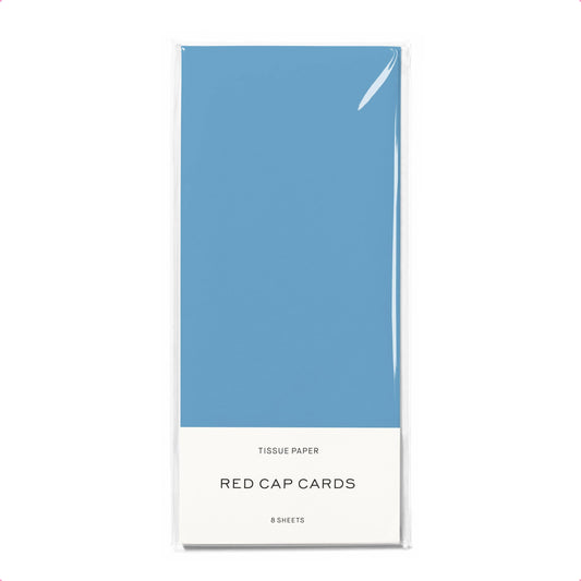 Blue tissue paper pack with 'Red Cap Cards' branding on a white background