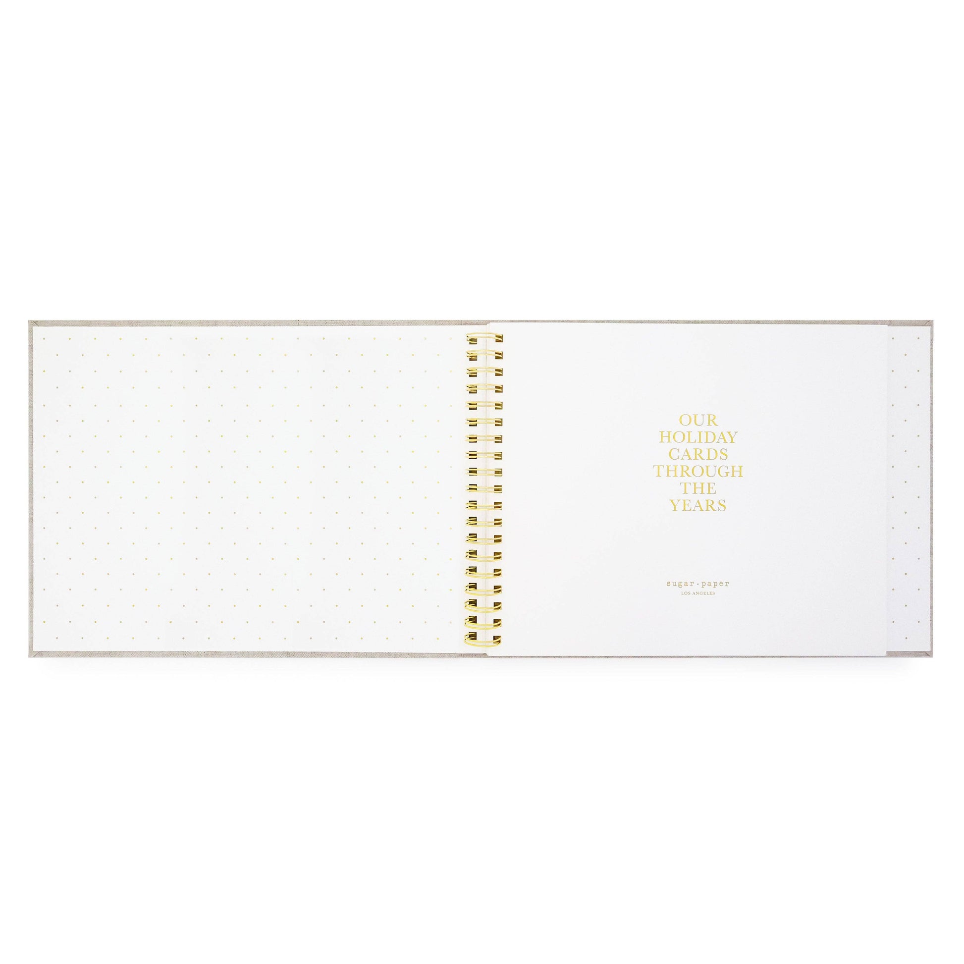 Spiral-bound planner with gold binding on a white background