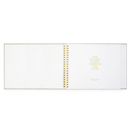 Spiral-bound planner with gold binding on a white background