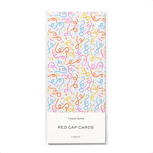 Tissue paper packaging with colorful question mark pattern on a white background