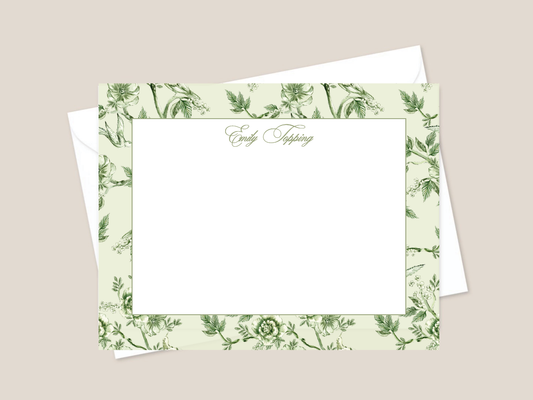 Floral stationery set with a card and envelope on a beige background