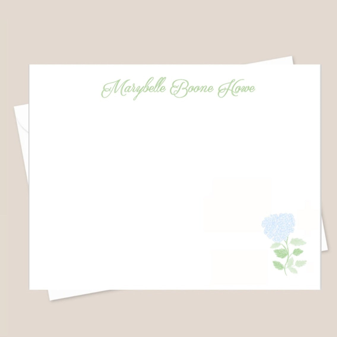 A set of white flat notecards with a small blue flower illustration and the name 'Marybelle Boone Howe' printed on the front.