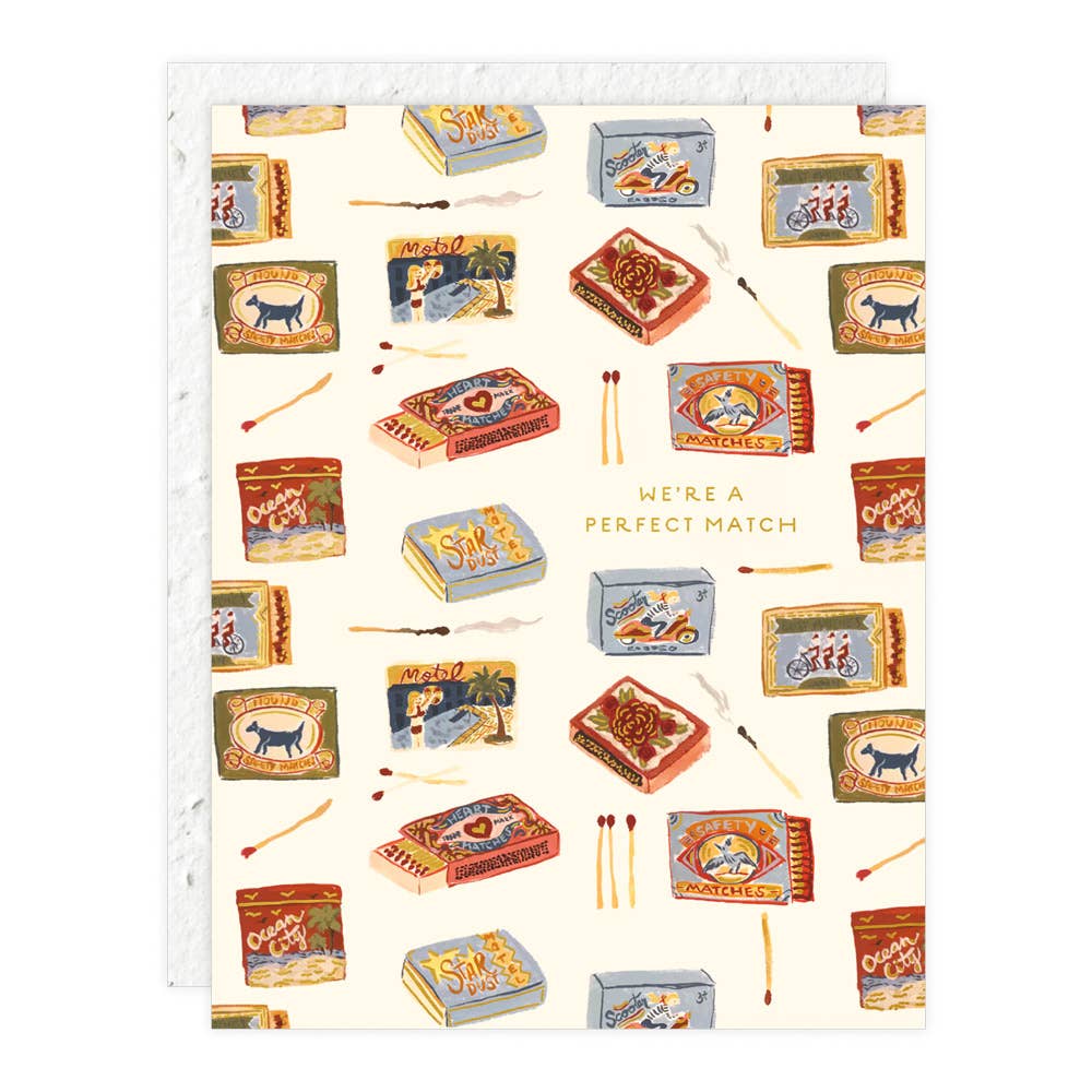 Notebook with matchbox design and 'We're a Perfect Match' text on a white background